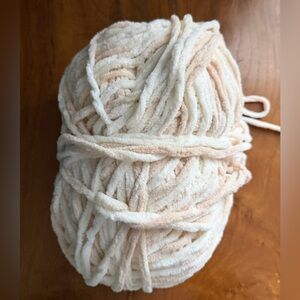 269 grams Bernat Blanket cozy yarn in Beach Foam shades of cream